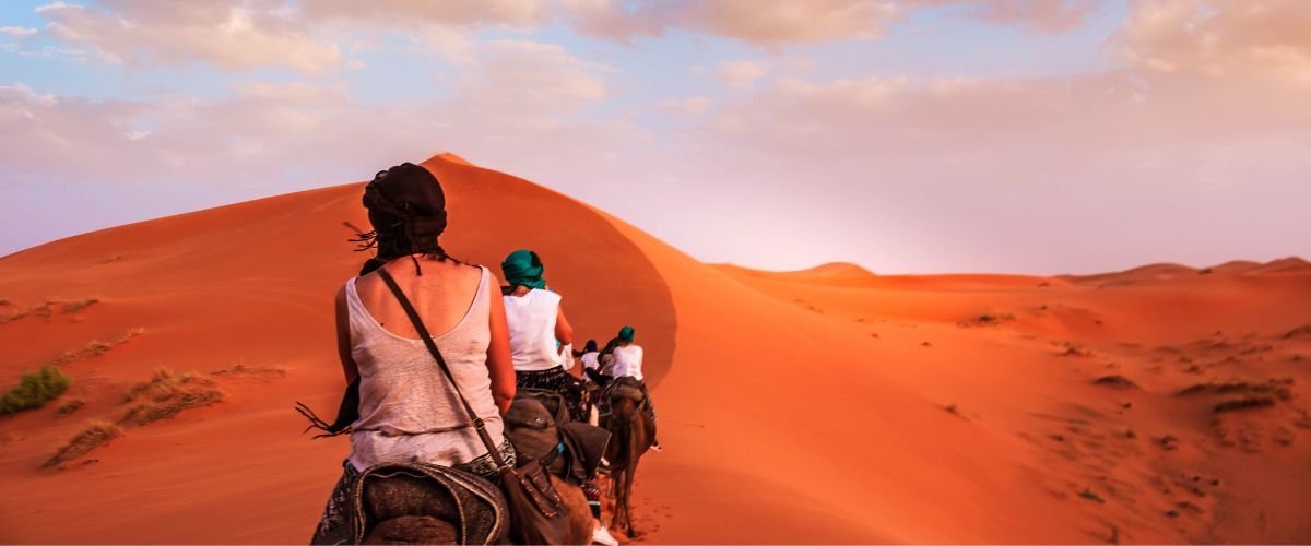 Women on camelback in Morocco